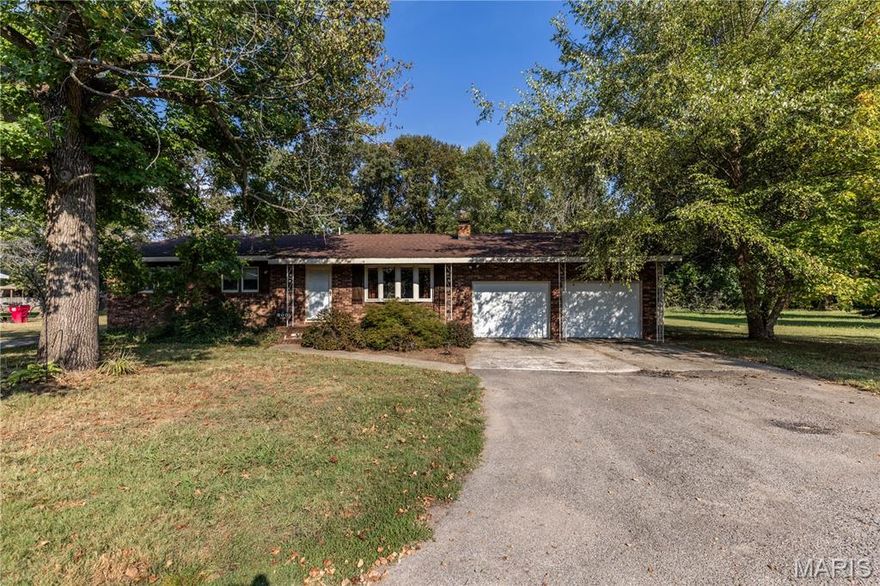 This beautiful home sits right outside city limits in a very desirable neighborhood!  This 2 bedroom 2 bath home has a semi open floor plan and a great flow!  The home was once  a 3 bedroom home and could be made back into one if desired!  When you enter you will notice that there is a beautiful fireplace with built in shelving. Kitchen is open with a place for a dining table or could just use bar stools if no table needed, lots of cabinets, and all appliances stay!  The beautiful sunroom on the back of the house provides an amazing and cozy space to settle in after work and relax or have your morning coffee!  Now when you enter the primary suite the bathroom is huge and has all the features including a large soaking tub.  The primary bedroom is large with a huge walk in closet!!  There is also a custom gun closet in the main hallway! Let not forget that this home has a fully fenced back yard and a large shop as well!!  Schedule your tour today!