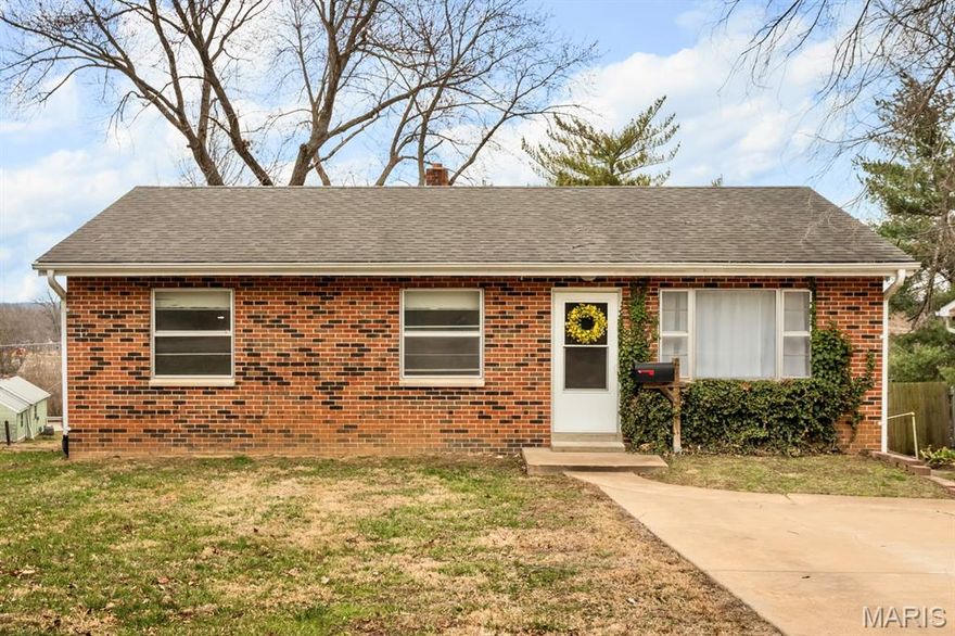 JUST LISTED! Fantastic opportunity for this charming, solid brick ranch with walk-out lower level! Light & bright living room with original hardwood floors, recently updated kitchen with white cabinets, tile backsplash, and ample storage. Great primary bedroom with adjoining half bath, plus two more bedrooms & updated full bath off the hall. Light-filled lower level with two egress windows & a walk-out door, providing so much potential to double your living space or even add bedrooms in the future! Nearly quarter acre lot that's perfect for throwing the ball, plus concrete sidewalk & steps wrapping around to side porch off the kitchen. Convenient West County location, award-winning Valley Park School District & Sacred Heart Parish just steps away, plus so many parks, shops & restaurants nearby. Lovingly cared for by the same owner for decades, many updates have already been done for you & now just a few last updates would really make this the perfect home in the perfect location!