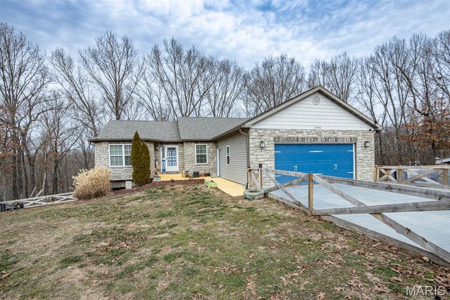 Great opportunity to own a 4 bedroom, 3 full bath home on 3.53 acres in the Waynesville School District. Step into this spacious home with oversized family room, breakfast room, kitchen with center island, and formal dining room with sliding glass doors that lead to the deck and down into the fenced yard. Main level includes 3 bedrooms, 2 full baths and the laundry room.  Head down into the basement where you fill find an unfinished storage area plus, in the finished area, another bedroom, living room with a kitchenette, full bath, and an office with a window(or could be used as a 5th bedroom).  Walk out to the back yard where you will find a firepit area, chicken coups, small storage shed, apple trees, pear trees and blueberries.  There is a trail that leads out into the additional acreage behind the house. Special features include 2 hot water heaters and a water softener and an oversized 2 car garage with built in shelving.  Don't miss out on this one of a kind property.