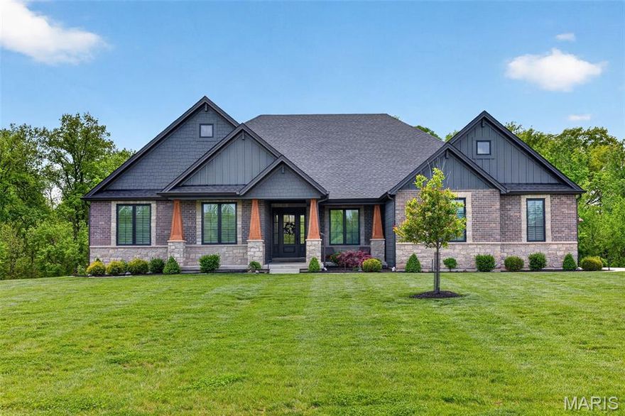 Looking for the perfect multi-generational home or private in-law suite with its own entrance? This custom-built Lombardo Ranch on 5.44 acres checks every box. Thoughtfully designed with high-end upgrades throughout, this home blends style, comfort, and function in every detail.
On the main level, you’ll find a chef’s kitchen featuring white custom cabinetry, quartz countertops, a striking stone arch over the cooktop, and premium appliances. Floor-to-ceiling windows flood the open living area with natural light, accentuating the hardwood floors, soaring ceilings, and custom finishes. The main level also includes the primary ensuite and two additional bedrooms, plus designer details such as smart-home technology, custom closets, and even a private cocktail lounge. The lower level lives like its own home, offering a full luxury kitchen, spacious living room, private study, and an additional primary suite—all with its own separate entrance. Perfect for multi-generational living, guests, or extended stays. Step outside to enjoy the serene setting—whether you’re relaxing on the covered cedar deck, unwinding on the patio, or envisioning a future pool in the private, level backyard framed by mature trees. All this, just minutes from wine country and within 10 minutes of the Hwy 40 corridor. This will become a gated community this spring/summer!