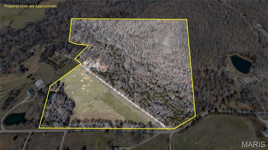 44.23 acres of opportunity, privacy, and wide open potential. This property offers a beautiful blend of fenced pasture and mature wooded acreage, creating the perfect balance for livestock, recreation, or a future homesite.

A stocked pond is tucked into the trees, providing both a peaceful setting and a great feature for fishing and enjoying the outdoors. The fenced pasture area is ready for animals, while the wooded ground offers natural cover and excellent wildlife habitat.

Improvements are already in place, including a cow barn, tractor shed or pull barn, carport with lean to, and a 20x20 insulated shed with a concrete floor that is ideal for a workshop, equipment storage, or secure space for tools. Three 50 amp RV hookups with dedicated pads make the property perfect for campers, guests, or extended stays during hunting season.

A huge elevated Shadow Hunter deer blind with star rated features and a built in porch overlooks the woods, offering impressive views and serious hunting potential. A late 70s Ford 4000 tractor can be included with the property, adding even more value and functionality.

With open areas that would make an excellent building site, this property offers the space and flexibility to build your dream home while enjoying pasture, privacy, recreation, and infrastructure already in place.