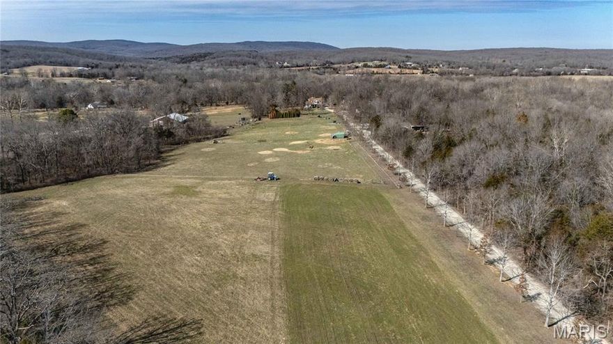 44.23 acres of opportunity, privacy, and wide open potential. This property offers a beautiful blend of fenced pasture and mature wooded acreage, creating the perfect balance for livestock, recreation, or a future homesite.

A stocked pond is tucked into the trees, providing both a peaceful setting and a great feature for fishing and enjoying the outdoors. The fenced pasture area is ready for animals, while the wooded ground offers natural cover and excellent wildlife habitat.

Improvements are already in place, including a cow barn, tractor shed or pull barn, carport with lean to, and a 20x20 insulated shed with a concrete floor that is ideal for a workshop, equipment storage, or secure space for tools. Three 50 amp RV hookups with dedicated pads make the property perfect for campers, guests, or extended stays during hunting season.

A huge elevated Shadow Hunter deer blind with star rated features and a built in porch overlooks the woods, offering impressive views and serious hunting potential. A late 70s Ford 4000 tractor can be included with the property, adding even more value and functionality.

With open areas that would make an excellent building site, this property offers the space and flexibility to build your dream home while enjoying pasture, privacy, recreation, and infrastructure already in place.