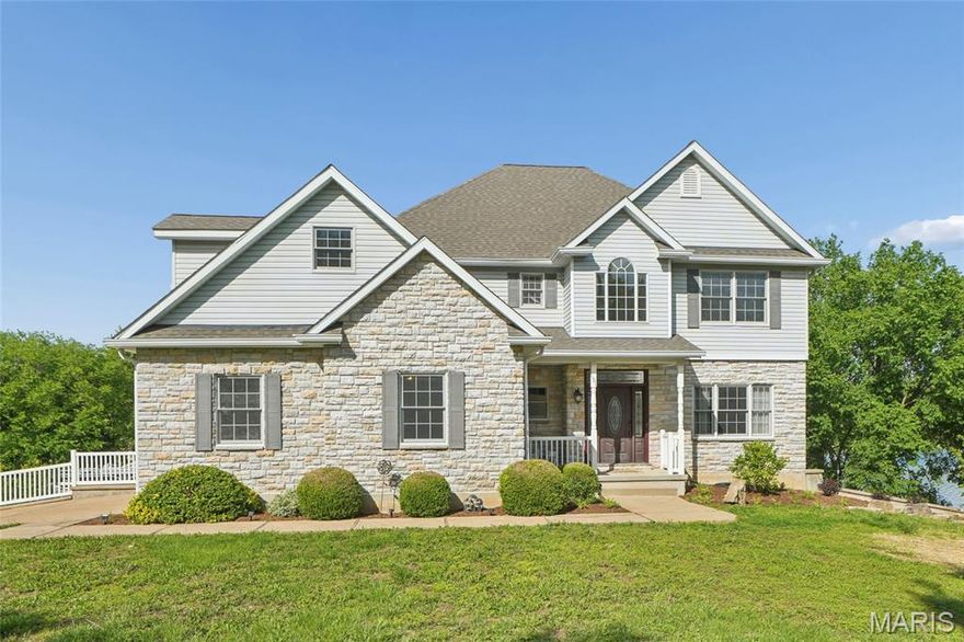 Just in time for summer entertaining! Experience true resort-style living in this remarkable 4-bedroom, 4.5-bath, one-and-a-half-story lakefront residence offering over 4,200 square feet of thoughtfully designed living space. Perfectly situated on two beautifully landscaped lots within a gated community, this home delivers luxury, privacy, and unforgettable views of Summer Set Lake. 

Abundant natural light fills the home, highlighted by a stunning Palladian-style window in the great room, soaring 18-foot ceilings, and a dramatic stone front wood-burning fireplace. The open floor plan creates seamless flow for both everyday living and entertaining. Just off the kitchen, a cozy breakfast nook provides serene lake views, while the kitchen itself offers generous storage, beautifully crafted cabinetry, and ample counter space—ideal for preparing meals or hosting holiday gatherings in the formal dining area. 

The expansive primary suite on the main level is a true retreat, featuring rich hardwood flooring, elegant coffered ceilings, and direct access to the deck overlooking the lake—perfect for enjoying peaceful evenings by moonlight. The recently remodeled en suite bathroom is exceptionally appointed with a mounted television, corner jacuzzi tub, walk-in shower, and a double-bowl vanity with oversized tile. A charming bay window frames breathtaking lake views that make this space truly one of a kind. 

A second primary bedroom option is located on the upper level and includes a private full bath with tub/shower combination, along with an expansive walk-in closet offering abundant upper and lower shelving. Also on the upper level are the third and fourth generously sized bedrooms, filled with natural light and connected by a full bathroom. The rear bedroom features stunning lake views. 

The finished lower level takes entertainment to the next level. It features two bar areas, with stools included. One bar is equipped with matching Galanz refrigerator and microwave, while the second showcases beautiful copper countertops, a kegerator, ice maker, and dishwasher. Between the bar areas is an impressive 8-seat theater with power-reclining seating, a 100-inch screen, and a Bose sound system. After movie night, enjoy the adjoining billiard room for a friendly game of pool. Music enthusiasts will be especially impressed by the soundproof recording studio, complete with CAT 6 wiring and XLR, making movie nights and game days truly unforgettable. 

Outdoor living spaces are equally exceptional. A custom gazebo integrated into the deck overlooks the tranquil lake, while the backyard oasis features a newer 34' x 13' irregular in-ground heated and cooled pool, complete with chaise lounge chairs and umbrellas, as well as a brand-new 2025 Dr. Wellness 8-person hot tub. Additional outdoor amenities include designated cooking areas, a built-in stone fire pit, and expansive decking designed for gathering with friends or relaxing by the water. 

Lake enthusiasts will love the private 25' x 22' boat dock, featuring a single boat slip and a slide directly into the lake, offering endless waterfront enjoyment right in your own backyard. 

Additional highlights include EV hookup in the lower level, copper plumbing, upgraded exterior doors with thumbprint entry, a new roof installed Summer 2025, and a dual HVAC system that is just one year old. Many personal property items are also included. 

This one-of-a-kind lakefront home seamlessly blends elegance, recreation, and luxury—offering a rare opportunity to own a premier property designed for making memories year-round. This exceptional home will not last long.