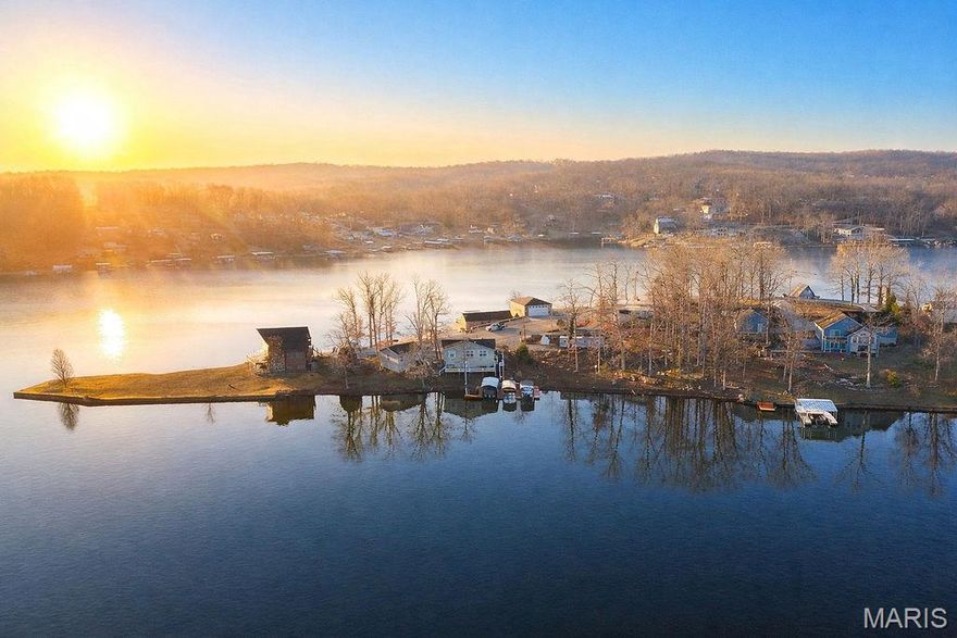 Welcome to your ultimate lakefront retreat on the shores of beautiful Goose Creek Lake! This remarkable property offers a rare combination of space, privacy, and endless recreation, boasting over 216 feet of pristine lake frontage. Whether you are looking for a full-time residence or the perfect weekend getaway, this home is designed to help you live the "lake life" to the fullest.
The Waterfront & Outdoor Oasis
The exterior is a true showstopper. Situated on a sprawling lot, the property features two stationary boat docks equipped with lifts, ensuring your watercraft are always ready for a day on the 350+ acre lake. As an incredible added value, this sale includes a 1988 24-foot Lowe pontoon boat powered by an 88 hp Johnson motor—meaning you can start enjoying the water the very day you close! After a day of boating, retreat to the massive 38-foot full-length deck to enjoy panoramic views of the water.
Spacious & Updated Living
Inside, you will find a thoughtfully expanded floor plan featuring 4 spacious bedrooms and 2 full bathrooms. A major highlight is the 12 x 38 room addition off the back of the house, providing a massive secondary living space or sunroom that floods with natural light and offers stunning lake views. The home feels fresh and modern with newer flooring throughout and the peace of mind that comes with a new roof installed in 2022.
Heart of the Home
The kitchen is fully equipped for hosting, featuring warm wood cabinetry, a functional center island, and plenty of counter space. The best part? All kitchen appliances stay, along with the washer and dryer, making this a truly turn-key opportunity. The open-concept living area and dedicated office space make it easy to balance work and play.
Garages & Storage
In addition to the lakeside charm, this property offers exceptional storage for all your toys. There is a two-car detached garage perfect for vehicles or a workshop, plus additional outbuilding space (as seen in the photos) that provides ample room for ATVs, golf carts, or lake gear.
The Goose Creek Community
Located within the highly sought-after, gated community of Goose Creek, you’ll enjoy 24/7 security and a vibrant social calendar. This private oasis offers a premier 350+ acre lake for fishing, swimming, and boating, plus many community activities throughout the year that make every day feel like a vacation.
Don't miss your chance to own one of the most significant pieces of shoreline on the lake. Grab your flip-flops, jump on your pontoon, and start making memories at Goose Creek!The sewer has 1200 gallon sewer Holding Tank that has to be pumped regularly.