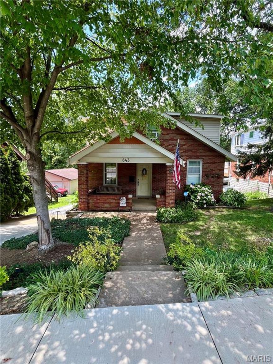 Welcome to 843 N Florissant. Conveniently located with quick access to I-270, I-170, and I-70. Walking distance to January Wabash park, and close to local shopping/dining. A 1934 Bungalow full of built in features, large lot with huge driveway, walk out basement, and a gardener's paradise full of perennial plants.  Main floor features built in bookcases in living room, cabinet storage in Dining, Large Wardrobe in back bedroom and built in bookcases in front bedroom. Upstairs is ready for fun, family room is prewired for surround sound. Office area has two large desktops with multiple work stations for computers, sewing, built in easel, large walk in closet, and more. The upstairs bedroom has a built in custom loft bed (side rail folds down), and walk in closet with drawers and shelves galore. Outside a shady covered back porch, large driveway that will accommodate many vehicles, concrete patio for outdoor lounging/ dining includes lighting and shade sails, sandbox, raised garden beds, and a secondary paver patio, for flexible uses bonfires, car parking, etc. Lots to love here!