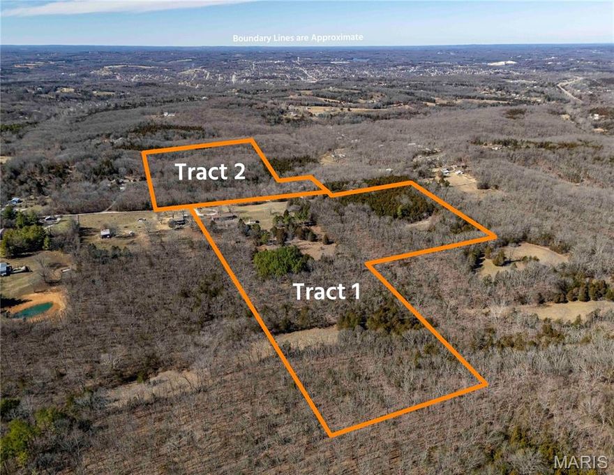AUCTION LISTING - List price is not indicative of Seller’s final reserve amount.  This property is part of an online bidding event.  This sale will be executed with a no-contingency contract provided by brokerage representing the Seller. See MLS Supplement Document for complete details. Located near De Soto in Jefferson County, this 40± acre property offered in 2 tracts offers a practical mix of open ground and mature timber. Fisher Branch Creek runs through the farm, along with a small pond that supports both wildlife and recreation. The wooded ridges and bottom field along the creek create natural travel corridors, making this a strong setup for deer and turkey hunting with room for food plots and stand locations. The home includes 3 bedrooms and 3 full baths with a large kitchen offering solid cabinet and workspace. A partially finished walk-out basement adds living area with a wood-burning fireplace, cedar closet, and a dedicated cellar/storm shelter room. The layout allows flexibility for family use, storage, or hobby space. Improvements are built with function in mind. A four-car tandem garage includes a workshop space, and a rear-entry single-car garage in the basement gives added storage for equipment or recreational vehicles. A 24’x24’ metal building with concrete floor and electric offers additional shop or storage capacity. An invisible pet fence encircles the house and is approximately 3± acres (functionality & collar availability is unknown).