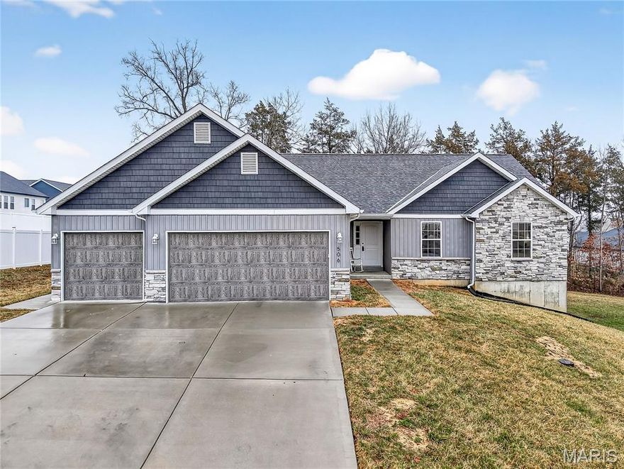 This Craftsman style 3-bedroom, 2-bath home is only 4 years young & offers comfortable living with upgrades throughout! Vaulted ceilings, 42" white shaker cabinets with granite countertops. The bright and inviting living area flows seamlessly into a beautifully appointed kitchen featuring a large island and ample cabinetry—perfect for everyday living and entertaining alike. Continue your entertaining into the dining room off the great room or use it as an office or flex space! A HUGE mud room adds everyday convenience and organization. Step outside on to the back deck & enjoy the tree lined backyard —ideal for gatherings or quiet evenings at home. 

The spacious primary suite provides a relaxing retreat, complete with a private en suite bath showcasing a custom walk-in shower & separate toilet room. Two additional bedrooms and a second full bath offer flexibility for family, guests, or a home office. The walk-out basement with rough-in provides excellent potential for additional living space, recreation, or storage. Conveniently located near schools, shopping, dining, and easy highway access, this move-in-ready home combines comfort, function, and charm. Don’t miss your opportunity to make it yours! (New fridge & washer/dryer to convey with sale) (Garage 21'/23' depth, 29' wide complete w/man door!)