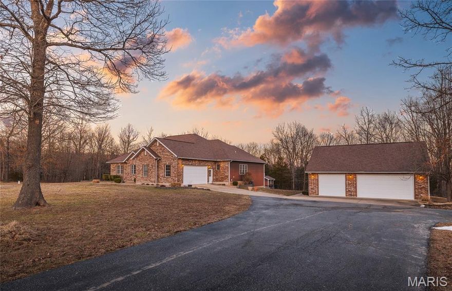 Properties offering this combination of acreage, privacy, and square footage, all within minutes of town, rarely become available. Situated on 5.93 acres in desirable 21st Century Estates, this custom home delivers space, flexibility, and a peaceful setting that is increasingly difficult to find.

The main level is designed for comfortable everyday living, featuring an open kitchen, dining, and living layout centered around a warm propane fireplace and real hardwood flooring. The recently refreshed kitchen offers solid surface countertops, JennAir stainless appliances including double wall ovens and gas range, abundant cabinetry, island workspace, peninsula seating, and pantry storage.

Three bedrooms are located on the main level, including a spacious primary suite with dual vanities, soaking tub, walk-in shower, and walk-in closet. The walk-out lower level provides a large private bedroom suite with full bath and walk-in closet, expansive living space with 9-foot ceilings, and two additional full bathrooms, offering flexibility for guests, extended living needs, or private retreat space.

Outdoor living is equally compelling, with a screened porch and an in-ground heated pool featuring safety fencing and motorized cover. The nearly 6-acre setting offers a blend of open land and mature trees, creating both usability and natural privacy.

Additional features include attached oversized garage, detached 30x36 three-car garage, roof replaced in 2017, and a setting that combines peaceful rural living with convenient access to town amenities.

Homes offering this level of space, land, and privacy in this location do not come along often.