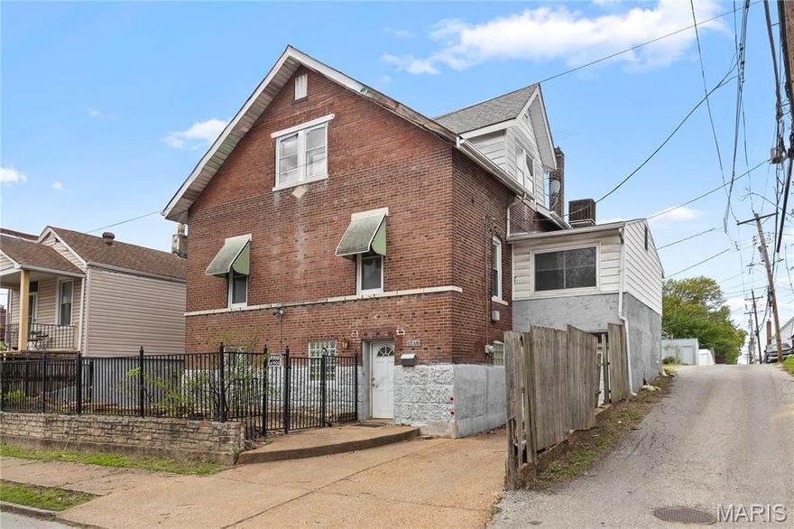 Historic raised 2-story renovation opportunity on The Hill with approx 1900 SQ FT, 4 bedrooms and 2 baths. Corner location, predominant brick exterior with fenced front yard, GARAGE addition. Staircase up to bright living room. Newer STAINLESS STEEL kitchen gas range and dishwasher. Huge 22-FT REC ROOM over garage. Formal dining, family room, full bath with tub/shower combo, and 3-season SUNROOM with sliding door to FENCED PATIO. Bedrooms upstairs with views of city lights, plus hall bath with shower. Vinyl tilt-in INSULATED WINDOWS and newer DUAL HVAC systems. Short walk to award-winning RESTAURANTS! Close to world-class 1370-acre FOREST PARK (nature reserve, lakes, boating, museums, zoo, science center, theater, sports, 2 golf courses and more), near Highways 44/100/64 and popular St Louis attractions. Property to be conveyed in its current condition.