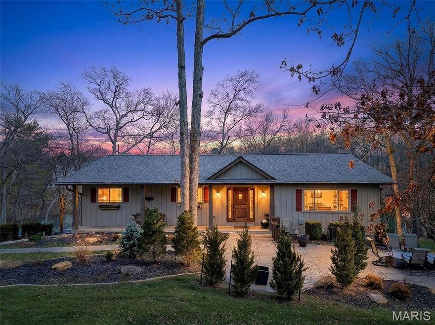 This wooded waterfront retreat on 1 full acre delivers the perfect combination of rustic warmth and thoughtful updates. From the moment you step through the updated front door into the vaulted, beamed entryway, you’ll feel the presence and craftsmanship that set this home apart. Rich wood floors flow throughout the main level, complemented by crown molding and timeless finishes. The kitchen is both beautiful and functional, featuring 42" custom cabinetry, granite countertops, stone backsplash, Bosch stainless steel appliances, smooth-top stove, breakfast bar, and eye-catching glass corner cabinets. The spacious dining room is ideal for gatherings and offers access to the huge deck. The primary suite is generously sized with dual closets and a well-appointed bath including double sinks, a garden tub, tiled shower, and crown molding. A dedicated main-floor office with custom cabinetry, additional deck access and amazing lake views provides the perfect work-from-home setup. Step outside and experience what truly makes this home exceptional — a two-level deck overlooking the water, a peaceful 3-season sunroom, a 26x17 stone patio with firepit, and your own 11x29 putting green. This backyard was designed for entertaining, relaxing, and everyday enjoyment. The walk-out lower level adds incredible versatility with a spacious family room anchored by a custom wood entertainment center, a separate rec room with pocket doors ideal for game tables or media space, a full bath, an additional bedroom, additional laundry area, and a dedicated workshop for projects or storage. A rare opportunity to own a private waterfront property that offers both everyday comfort and standout lifestyle features.