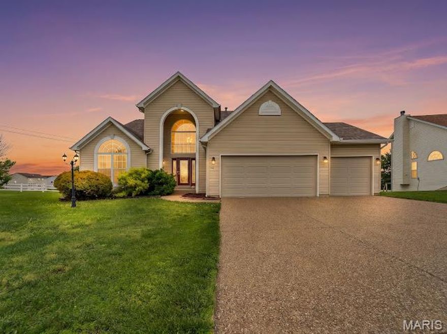 This spacious home offers room to spread out both inside and out with a finished walkout lower level, oversized living areas, and a backyard designed for relaxing and entertaining. The exterior features attractive curb appeal, a 3-car garage, and a covered upper deck overlooking the yard. Inside, you’ll find soaring ceilings, large arched windows that bring in natural light, and multiple living and dining spaces. The primary suite includes a spacious bathroom with dual vanities, soaking tub, and separate shower. The finished walkout basement provides additional living space perfect for a family room, recreation area, home office, workout room, or guest setup. Enjoy outdoor living from the screened/covered deck and lower patio area with plenty of yard space to enjoy. Conveniently located in Wentzville with easy access to shopping, dining, schools, and major highways.