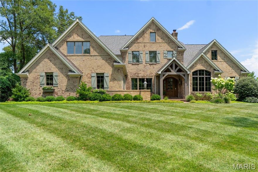 Welcome to 611 Hickory Lane, a resort-style estate in coveted Frontenac, located within the highly sought-after Kirkwood School District. Offering 7,000+ sq ft of beautifully appointed living space, this 11-year-young home is the perfect blend of timeless luxury, modern functionality, & refined comfort. Just off the expansive chef’s kitchen, the cozy yet stunning family rm features a fireplace and wood-beamed ceilings, creating an inviting space for everyday living. The kitchen also opens to a formal dining rm, which flows effortlessly into a sophisticated hearth room—designed for seamless entertaining & connected living. Upon entry, a richly appointed private office & a moody, gorgeously decorated den offer elegant spaces for work or relaxation. The main floor primary suite is a luxurious retreat, w oversized windows & an en-suite bathroom that evokes a five-star spa experience. The lower level continues the elevated living experience with a full wet bar, guest suite, and multiple recreation areas perfect for entertaining or unwinding. Outside, your private resort awaits—with a sparkling pool, built-in grill, wood-burning fireplace, and lushly landscaped lounge areas designed for unforgettable gatherings. Beyond the fenced yard, a peaceful stretch of private land includes a charming chicken coop & its beloved resident, Ethel the hen. A three-car garage & newer, meticulously maintained systems complete this extraordinary property—where luxury, comfort, & character converge.