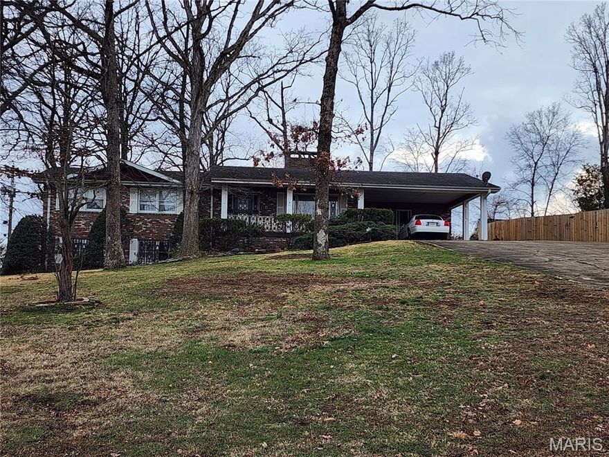 Welcome to 2001 Woodhaven in the ever popular Bluff Estates subdivision.  This classic, all brick home was custom built back in the 70's and many of the featured amenities are still beautiful today and show off the timeless elegance.  With 3000 SF of living space this home offers three bedrooms (could be four), three baths, large rooms, finished basement with a 28 X 28 great room, an updated bath with tile shower & granite counter,  whole house vacuum system and more.  The kitchen is lined with heavy duty, solid oak cabinets and a large Island with seating.  The large yard is loaded up with mature landscaping that will be popping soon as spring approaches.  The brick exterior and the ornate, wrought iron storm door and window guards along with seamless guttering are all in great shape and will be worry free for years to come.  There is no way you could build this size home in a great location for the asking price of  this one.  Schedule your appointment today for a personal viewing.