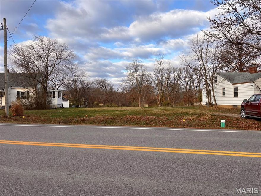 Nice level city lot with 70 feet of Hwy 47 frontage just past Casey's convenience store. House was recently removed from property and is now a vacant lot. Ready for a new home to be built or potential commercial as this lot is zoned R2 - makes for a great small business site. High traffic county in rapidly growing Warren County.