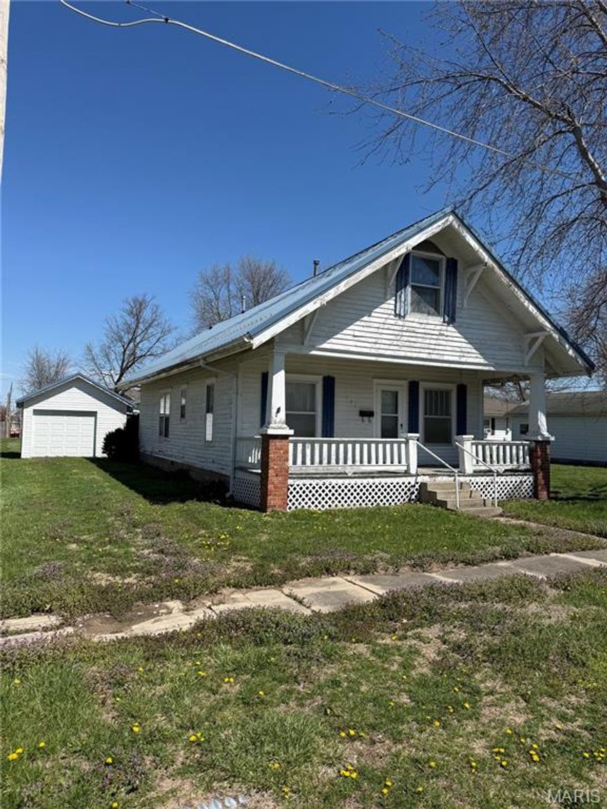 Welcome to this charming 4-bedroom, 1-bath bungalow in a quiet small town, perfect for family living. This inviting home features a spacious layout and cozy atmosphere. Included is an additional 85 x 33 lot, offering extra space for gardening, recreation, or future expansion. The property also boasts a 30 x 27 pole building shop with a wood stove and alley access, ideal for hobbies or storage. Enjoy the tranquility of small-town life while remaining close to local amenities. This unique property combines comfort, functionality, and potential—don’t miss your chance to make it your own!