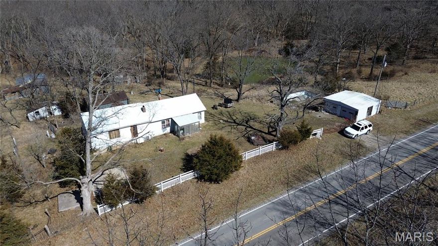 10.59 unrestricted acres in Fulton Schools with blacktop frontage and utilities on-site! This mostly wooded tract features rolling terrain, a stocked half-acre pond, and a detached shop already in place. Whether you're looking to build your dream barndominium, create a private retreat, or invest in land with long-term potential, this property offers the freedom and setting to make it happen. Private, peaceful, and selling as-is -- opportunities like this don't come along often. SOLD AS IS