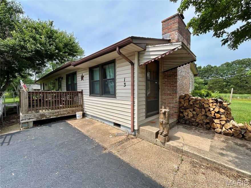 Call to schedule your private showing today! This 3-bed 2-bath home is located outside the city limits just 5 minutes from Steelville. Located on 4.5 acres with a beautiful country setting. The home has a large front porch & a concrete walkway leading to the garage. Newer propane furnace, electric baseboards and a woodburning fireplace. The kitchen has solid oak cabinets and hard surface countertops. Added character of Hardwood flooring in the living room and 2 of the 3 bedrooms. Multiple outbuildings including a 2-car garage, garden shed, she shed/tiny workshop and a barn with a loft. All outbuildings have concrete floors. Many mature trees and flowering bushes scattered throughout the property. Nice pond that is stocked. Large front, back and side yard. Asphalt driveway leading up to the house. Well water and two septic tanks. If you are looking for country living but also want to be close to town, then this property is worth looking at. Do not hesitate to call and schedule a showing!!
