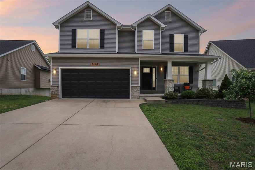 5 bedrooms • Backs to trees • Cul-de-sac street • Near Seckman High School • Deck + fire pit • Finished lower level • 3D walkthrough + Sky Tour Welcome to this spacious 5 bedroom, 3.5 bath two-story home in desirable Seckman Ridge, located on a quiet street ending in a cul-de-sac and backing to mature trees for added privacy and wooded views. Conveniently located near Seckman High School, shopping, restaurants, parks, and commuter routes, this home offers flexible living space, updated finishes, and indoor/outdoor entertaining areas.
The charming covered front porch with stone-based columns creates standout curb appeal. Inside, the main level features newer luxury vinyl plank flooring in the dining and living rooms, modern black panel doors, and multiple gathering spaces. The living room centers around a striking woodburning fireplace with dramatic black slat accent wall, wood mantle, and quartz hearth, creating a standout focal point.
The kitchen offers espresso cabinetry, quartz countertops, subway tile backsplash, center island, stainless steel appliances, and generous prep space, making it ideal for cooking and entertaining. Step outside to the deck overlooking the backyard, mature trees, and fire pit area, providing additional space for relaxing or hosting guests.
Upstairs, the spacious primary suite features a vaulted ceiling, wood shiplap accent wall, large walk-in closet, and en-suite bath with double adult-height vanities. Second-floor laundry adds convenience, while most bedrooms feature walk-in closets for exceptional storage.
The partially finished lower level expands your living options with a large family/recreation room, private 5th bedroom, and full bath, creating flexible space for guests, home office use, hobbies, or additional living needs.
Includes immersive marketing media with a 3D walkthrough, floor plan, Sky Tour, video tour, and Zillow Listing Showcase for an enhanced home search experience.