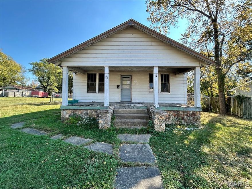 Large home that's been taken down to the studs and is ready for a rehab or take it down an build on the 2 city lots. This home was 3 beds & 1 bath, but now is a blank slate ready for your finishing touches. Full walk out basement and lots of character still exist.