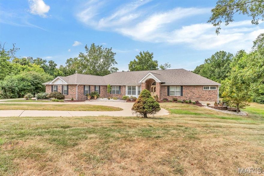 This is an INCREDIBLE Ranch style home with over 7000 sq ft!  Approximately 4500 sq ft on the main level and approximately 2700 finished in the lower level.
Main level has a grand entry into the Vaulted greatroom with stone fireplace.  A separate dining room with a coffered ceiling.  Primary suite with Luxury bath.  Open Kitchen, breakfast room, and hearth room.  Second fireplace is in the hearth room.  Three secondary bedrooms.  SIX Bathrooms:  Primary bath, hall half bath, full bath in bedroom #2,  jack n jill bath between bedroom 3 and 4, another half bath in the second hallway next to the main floor laundry and the lower level full bath.  
EXECUTIVE DEN!  The den is vaulted, lots of windows and natural light, enough space for bookcases and couches.  It looks like the OVAL OFFICE.  It includes the Bonus room/Hobby room.  
SIX GARAGES!  Main level has a 2 bay, and a separate 1 bay.  Lower Level has a tuck under 3 bay.   Circle drive in the front with another driveway to the left to large parking pad and patio. Lower level is finished with the fourth bedroom, a full bath with dual sinks,  kitchen area, LARGE open BAR area also known as the sitting room and living room.   This beautiful home overlooks the most incredible THREE ACRES!  Home has the right amount of open flat yard and surrounded by trees.   So much HOME, so much LAND, so close to highway access but yet tucked away in a quiet culdesac. Its own piece of Heaven. 
Listing Agent must approve all appointments.