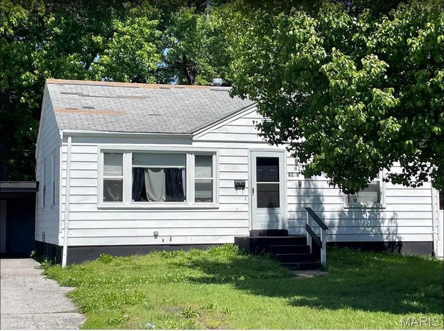 Nice 2+ bedroom single family with full basement and carport. HVAC 10/21 ~ Replacement Vinyl Windows 2/22 ~ Newer Cabinets, Sink, Fixtures in Kitchen, Laminate Floor ~ Full Bath, Original Ceramic Tile ~ 2 Bedrooms with 3rd the Original Dining Room ~  Small Wood Deck in Backyard ~ Tenant Occupied at $1,300 per month.