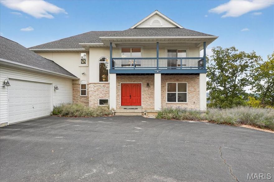 Nestled in a premier locale with sweeping vistas, this uniquely designed two-story residence offers an exceptional blend of space, style, and sophistication. The minimalist architectural element provides a dramatic first impression. Step into the foyer warmed by natural light with a sweeping staircase. A home office/library opens to the foyer and has a view of the front yard. The open concept living space is designed for effortless entertaining connecting the living room, chef’s kitchen/dining area and sunroom, each bathe in daylight, each having a fireplace and the breath-taking scenic view. A massive island anchors the kitchen, ideal for gatherings. Premium appliances, granite counters, and discreet walk-in pantry elevate both form and function. Enjoy your morning coffee on the deck where the sunrises are sure to mesmerize. Upstairs a spacious primary retreat with large walk-in closet, spa-style bath w/ separate soaking tub, shower, dual vanities and that fabulous view! Three additional bedrooms each with easy access to their own full bath and walk-in closet, ideal for family, guests, or flexible use like a home office or creative studio. The lower level is finished with painted concrete floors for function/style and plenty of windows. This level is a wonderful space for a recreation area, game room, or theater room. A separate bed/bath and workout room complete the walk out lower level. Stunning panoramic views all the way to the St Louis Arch on the horizon!