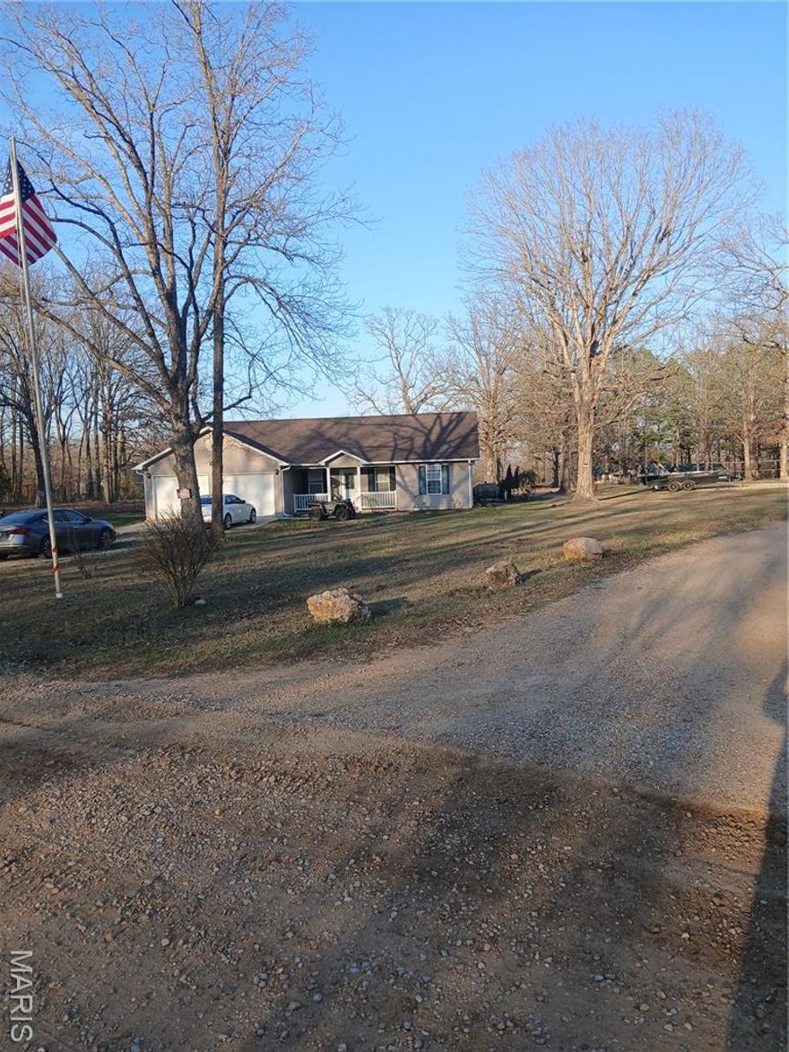 What a beautiful home! This home sits nestled on 1.8 acres just outside city limits. The roof is less than one year old! With 3 bedrooms, 2 baths, this home has space for the family. The cathedral wooden ceiling in the living room paired with the spacious and open concept kitchen that boasts beautiful wooden cabinets and an island sets this space up for gatherings! The primary suite has an enormous walk-in closet and bathroom with a nice sized, poured composite form-shower. All 3 bedrooms are nice sized with spacious closets. with a 2 car garage and storage building to store all your tools and yard equipment, keeping this beautiful parcel maintained won't be hard. The large, concrete patio is sure to give many times of peaceful enjoyment while overlooking the serene yard. Residence is occupied, please don't disturb residents. Showings by appointment only with prior notice.