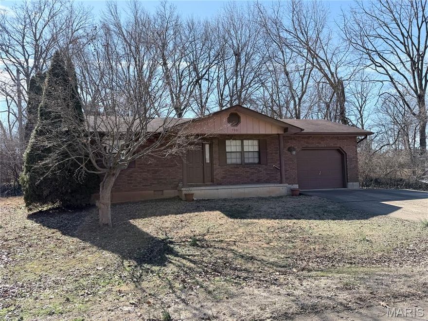 Charming 2-bedroom 1 bath home offering 977 sq ft of living space in Farmington. This property features an attached garage, open frame porch, and sits on a spacious lots, 1 & 2. Functional layout with comfortable living areas and practical storage. Located within the Farmington School District and convenient to local amenities.