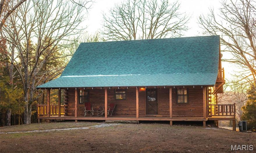 Just minutes from town and accessible off a paved highway, this 87 acre property offers convenience and seclusion. It features over 1/4 mile of Hog Creek, providing a peaceful backdrop for activities like fishing, swimming, or enjoying the beauty of nature. The custom-built cedar lodge spans over 2,100 sq ft and showcases true craftsmanship. With pine floors, custom beams, and black iron railings, every detail of this home has been thoughtfully designed. The spacious layout includes 3 bedrooms and 2 full baths, offering both relaxation and ample space for entertaining. Whether you're relaxing on the expansive front or back deck, the home offers the perfect spots to unwind while soaking in the natural surroundings. Tucked away in a grove of towering cedars, the lodge provides privacy while still being conveniently close to town and all necessary amenities. The property boasts a 40x60-foot all-steel shop building, equipped with electricity and double 12-foot lean-tos, plus a bathroom.