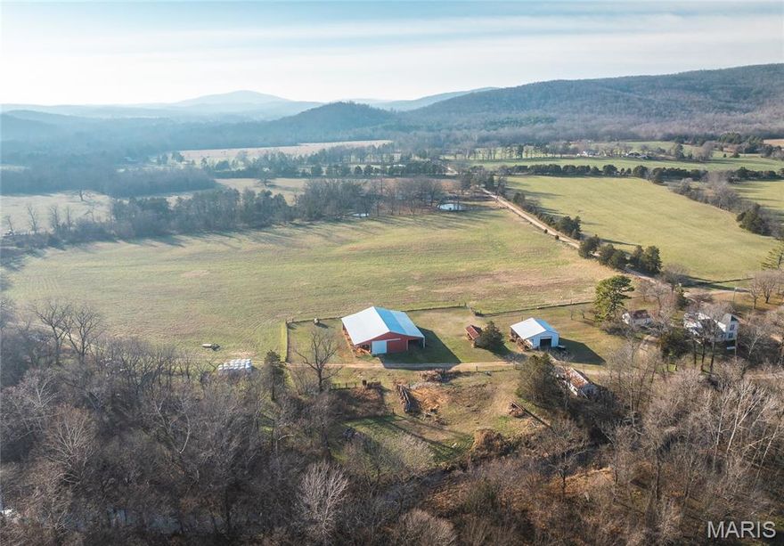 This exceptional 235-acre farm offers a rare combination of productivity, water, and improvements. The property features a farmhouse along with multiple barns, a spacious shop, county water, well water and is fully fenced, providing everything needed for a working agricultural operation or rural retreat.

The land is predominantly high-quality hay ground and tillable soil, making it well-suited for row crops, livestock, or continued hay production. A scenic creek runs through the entire length of the property, providing a reliable water source for livestock and enhancing the natural beauty of the farm.

Gently rolling to level terrain allows for efficient farming practices, while the mix of open fields and natural features creates excellent potential for recreation, hunting, or future expansion. With ample acreage, solid infrastructure, and abundant water, this farm presents a versatile opportunity for farmers, investors, or those seeking a large, productive rural property.

Whether you’re looking to expand an existing operation or establish a legacy farm, this 235-acre property offers the space, soil quality, and improvements to make it truly special.