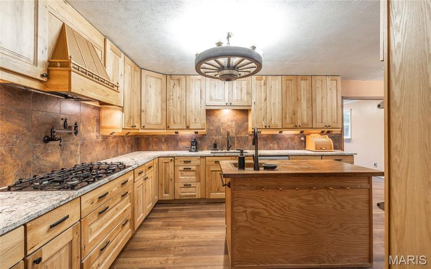 Welcome to your slice of country paradise! This beautifully renovated 4 bed, 4 bath home is nestled on 60+/- UNRESTRICTED acres, offering endless opportunities for your vision — whether it’s a hobby farm, homestead, or simply a peaceful retreat. Step inside to find a stunning kitchen with brand new oak cabinets, granite countertops, and a prep sink ready for cooking or entertaining. The entire home has been refreshed with brand new flooring, fresh paint and completely updated luxury bathrooms featuring jet tubs and multiple shower heads for that perfect mix of style and comfort. Some more functional upgrades include brand new siding, new roof and some new windows. Outside, the land is just as inviting — enjoy your own 5-acre lake, multiple storage sheds, a small orchard with fruit trees, and a sprinkler system to keep your garden thriving. A brand-new deck provides the perfect spot to soak in the views or host friends and family. With so many updates already in place, this property is truly move-in ready and waiting for its next chapter. Don’t miss your chance to see this gorgeous property  — call today to schedule your showing!