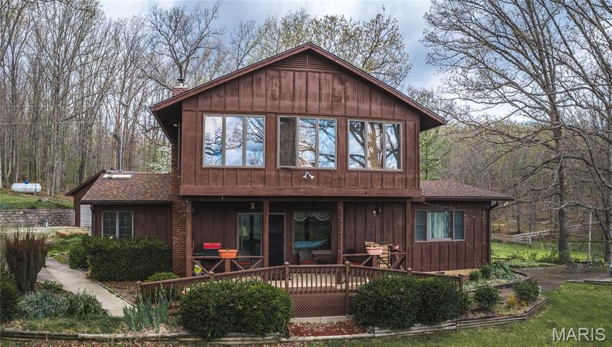 Tucked away east of Salem and surrounded by the beauty of the Mark Twain National Forest, this stunning 80-acre property that offers the perfect blend of privacy, comfort, and outdoor recreation.
The home features 4 bedrooms and 2.5 baths, including a versatile main-level mother-in-law suite that could easily serve as your primary suite with the other 3 bedrooms on the upper level. A recently remodeled kitchen, rich hardwood floors, and a warm, inviting living room with a wood-burning fireplace create a cozy, welcoming atmosphere. The enclosed sunroom provides the perfect spot to relax and take in the peaceful surroundings year-round.
Outside, the property continues to impress with a detached garage and an expansive 142’x70’ steel pole barn, formerly used as an indoor riding arena, offering endless possibilities for hobbies, storage, equipment, or livestock. A backup generator adds peace of mind, ensuring comfort in any season. Looking around, you see a landscaper's dream with tiered flower beds all around the home, an old school well house, a cellar, and new steel fencing. 
The land itself is a true highlight, featuring mostly wooded acreage with a serene creek winding through it, visible from multiple points in the home and on the nice deck, complemented by beautiful pine groves and mature oak trees. Open areas that are perfect for horses, food plots, adding additional buildings, or other animals. Abundant wildlife makes for excellent whitetail deer and turkey hunting, while the nearby Meramec River offers even more opportunities for outdoor adventure just minutes away.
An opportunity to own a secluded, peaceful property in an unbeatable setting, this is country living at its finest.
