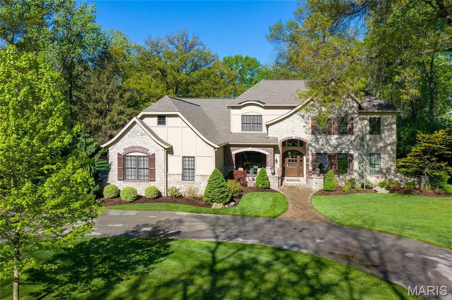 Nestled on a private street in the heart of Frontenac, this 6 yr new, 5 bed, 4 full and 2 half bath home exudes high end finishes and both formal and informal open spaces.  Over 7200 sq ft of finished  space with soaring ceilings, beautiful moldings, and hardwood floors throughout.  Find a wood paneled den/office, dining rm, formal open great rm, open custom kitchen with wet bar, lg center island, breakfast area opening to the family rm/hearth rm surrounded by windows highlighted by a custom stone fireplace.  A spa quality main flr master suite offers a jetted tub, walk in shower and custom closets.  A powder rm and mudrm complete the 1st flr.  Upstairs a 2nd fam area, bedrm suite and 2 additional lg bedrms share a Jack and Jill bath.  The knockout lower lev features a customized walk behind wet bar, temp controlled wine rm, a workout area, a rec rm, half bath and guest suite.  This home is a must see as it rivals any new construction in quality and finish.  4 car gar, Ladue schools. Additional Rooms: Mud Room