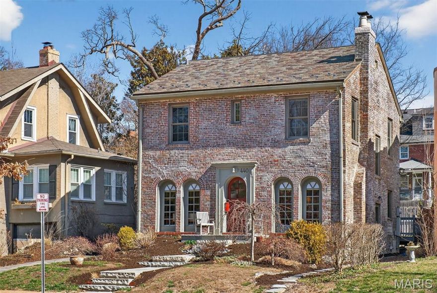 Multiple offers received.  Thank you.  Seller would consider a back up offer.  Steeped in history and filled with decades of joy and laughter, this timeless Colonial is ready to welcome its next chapter — and its next lucky owner — in the heart of downtown Clayton. Nestled in the beloved Wydown Forest neighborhood, where no two homes are alike and every street feels like a storybook, this is more than a house — it’s a lifestyle waiting to be lived. Imagine mornings that begin with a stroll to nearby parks, coffee shops, boutiques, and top-rated schools — all just steps from your front door. Even better? You’re only 15 minutes from almost everywhere you need to be. Walkability, charm, and convenience rarely meet like this. Approach along the newer stone walkway and step onto the welcoming full front porch, where life unfolds like your favorite feel-good movie. Sip something refreshing, wave to neighbors gathered around the community island just across the way, and feel friendships form in real time. Inside, the spacious double living room invites connection — a cozy fireplace nook to the right, a lively gathering space to the left. The oversized dining and activity room, complete with built-ins, flows seamlessly to the enormous, recently updated deck and lush rear gardens — perfect for celebrations, quiet evenings, and everything in between. The surprisingly expansive remodeled kitchen sits at the heart of the home, designed for togetherness. Whether preparing weeknight dinners or holiday feasts, this is where memories are made. A discreetly placed half bath and side entry add thoughtful convenience. Upstairs, modern glass-paneled railings lead to a primary suite spanning the entire width of the home — a true retreat with room to grow (and exciting potential for bath expansion). The light-filled hall bath offers generous storage, and two additional spacious bedrooms complete the level — including one that delights at every turn with custom Jungle Book murals, a magical space sure to spark imagination and smiles. The dry lower level awaits your personal vision — game room, creative studio, fitness zone, or the ultimate retreat. And the detached storage building (formerly a one-car garage, conveyed as-is) is a dream setup for gardeners and hobbyists alike. Homes like this — rich in character, wrapped in community, and positioned in one of Clayton’s most walkable, sought-after neighborhoods — do not come along often. The time is now. The place is here. Don’t deny yourself the joy.