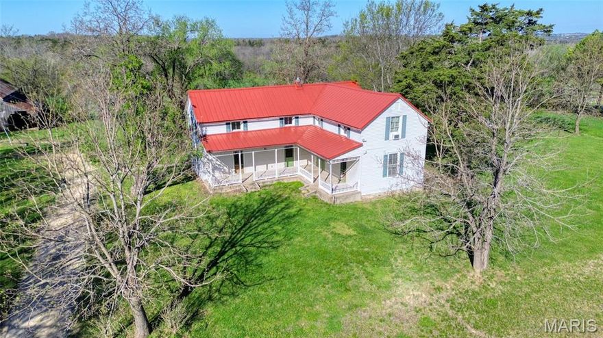 Quaint Country Farm House with orginal log portion of home that dates back to 1848 on beautiful 27+/- acres with creek and waterfall in WASHINGTON. Missouri wine country with a timeless 2-STORY HOME  built in 1846 boasting 3,645+/- SqFt, 3 bedrooms, 2 full baths, a 429+/- SqFt Studio building w/wood burning stove & large wood deck overlooking the stunning grounds and countryside, 2 BARNS with stalls, 2-car carport, CHICKEN COOP & meandering PICTURESQUE Long Branch CREEK. Perfect for a weekend getaway or everyday living. The Farmhouse has a covered front porch that welcomes you as you step inside the entry foyer.  Main level has 10’+/- Ceilings. The living room & dining room, Parlor, a quaint kitchen, built-in pantry, wood flooring & door to back porch. Main level Wood Floors and mostly upstairs as well. The Old log portion of the house offers a convenient office/mudroom, laminate flooring & walk-out door to the front porch. The entry hall has a full bath that completes the main level. The upper level has 3 bedrooms that all share a full bath.  The cellar/basement offers walk-up access to the back of the home. Well house offers storm shelter as well. Outside, you will enjoy the AWESOME VIEWS! The options are truly endless with this property. Make it yours TODAY. The 27 acres+-  is made of 2 parcels: Tax ID:10-9-31.2-0-000-006.300 & Tax ID:10-9-31.2-0-000-006.200 has pasture, tillable, creek with waterfalls, and timber for the buffer.  Come See!