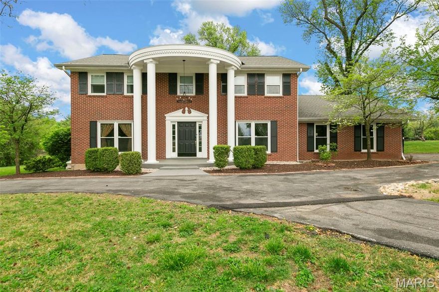 Welcome to your meticulously updated sanctuary at 128 Ladue Oaks Drive, nestled in the heart of Creve Coeur. This elegant 4 bedroom, 3.5 bathroom residence blends timeless colonial architecture with a fresh, contemporary interior, offering a ton of living space on a sprawling 0.98-acre level lot. Step inside to a bright and airy center-hall plan, now elevated with recessed lighting and fresh paint that flows through every room. The sophisticated main level features a modern kitchen Boasting a brand-new tile backsplash that complements the spacious layout and stainless steel appliances. Enjoy an abundance of storage with a dedicated pantry featuring a utility sink, perfect for prep work or tucking away small appliances. Expansive Hearth Room located directly off the kitchen, this inviting space provides the perfect atmosphere to relax by the fire or entertain guests, with a seamless walk-out to the private back patio. A stunning new staircase railing serves as a focal point in the foyer, while large bay windows and built-in bookcases add character to the living spaces. Upstairs find four large bedrooms and three full bathrooms. Upstairs laundry offers convenience you didn't know you needed! The traditional floor plan is enhanced by updated lighting, making it perfect for both quiet evenings by the wood-burning fireplace and large-scale entertaining. The living space extends into the partially finished basement, providing a versatile area for a home gym, media room, or play area. Outside, the near-acre lot offers a rare sense of privacy in Creve Coeur, featuring A classic brick exterior with an oversized 2-car side-entry garage and a convenient circle driveway.
