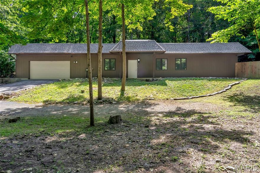 LET'S GET THIS SOLD! NEW PRICE! Tired of high and increasing utility bills? Unique opportunity in Hoene Springs! Earthen home located on almost a full acre
of wooden land with lots of privacy. Constructed of concrete (exterior walls are approximately 12" thick) provides for natural insulation, keeping utility costs at a minimum. Earthen homes are known for their sustainability, natural insulation, low environmental impact & unique appearance. This house blends nicely into the landscape & provides comfortable living environments that stay cool in the summer & warm in the winter. Completely renovated & new interior from top to bottom! Low-maintenance LVP flows thru the whole house & all rooms are freshly painted. The spacious front porch is perfect for enjoying the woods & natural wildlife. Once inside-the spacious Great room is perfect for entertaining & relaxing. The fireplace is plumbed into the HVAC system to assist in heating the whole house. The ample dining area flows into the galley kitchen with new cabinets & granite countertops. Utility area with washer/dryer hook-ups is between kitchen and oversized garage. Bedrooms are spacious & 2 share a full bath. The Primary suite includes oversized walk-in closet, full bath & opens to a fenced yard! Enjoy the privacy, surrounded by nature & the great location in Hoene Springs.  All systems are new & entire house is updated & move-in ready. Additional 2.6 acres available for purchase for additional privacy! Survey of both properties available.