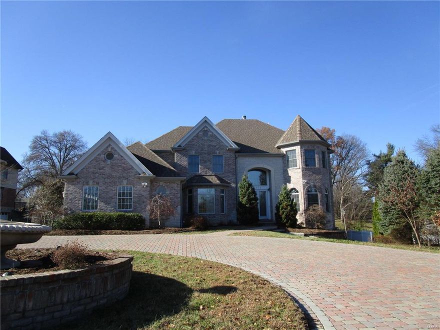 Stunning newer house with approx 7162 square feet of Living Space in Ladue Schools.  So much to love here.  The circular driveway leads to a 2 Story entrance with marble tile.  The large kitchen with center island has so much to love for the chef in the family.  The main floor master features jacuzzi tub and separate shower with his & hers sinks.  The basement is finished and has a mother in law's quarter that walks out to the back yard.  2 Fireplaces on the main level and 1 in the basement for those cold winter nights.  Large deep lot with gazebo has plenty of room for outdoor activies.  You will love the wood paneled office in the front of the house just off the entrance. SpecialListingConditions: Foreclosure