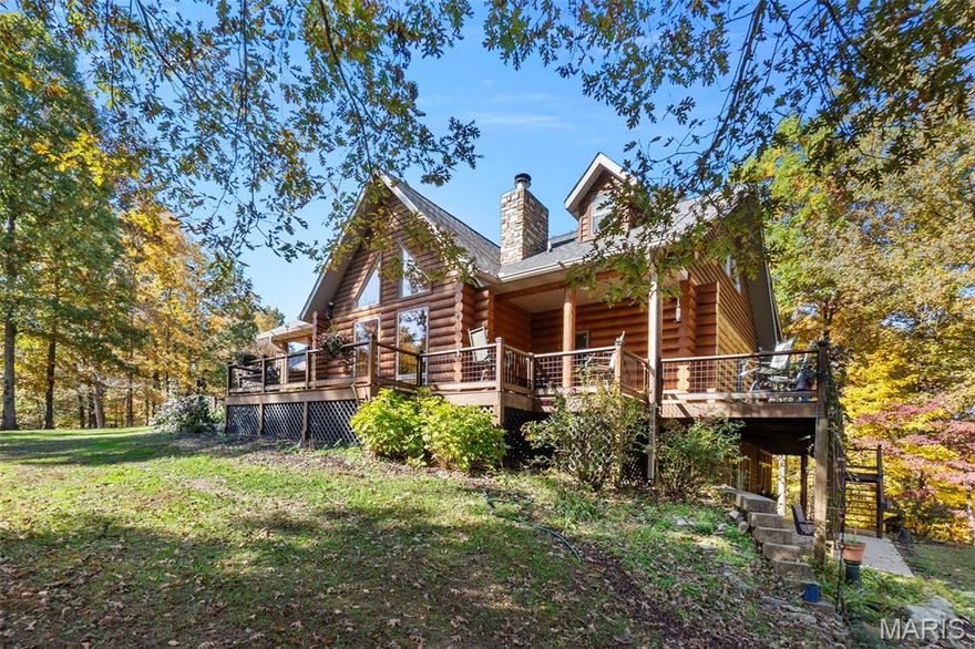 WELCOME TO BROKEN OAK – Where fine craftsmanship meets the solitude of nature *
Nestled on just under 8 acres of private, wooded splendor * If you dream of waking each
morning and retiring at night to a place of wonder, this splendid log home and setting beckons
your destiny * And with water frontage to a 5 acre neighborhood LAKE, you’ll not only enjoy
lake views, but you can fish and kayak, too ! * Brimming with custom features, the richness of
wood and fine workmanship abounds – Average does not reside here * Every turn, every
view soaks up something special * This rare 1.5 story gem boasts approx 3,700 SF of custom
living space * The soaring, light-filled 2 story Great Room is highlighted with a majestic
floor-to-ceiling stone fireplace, vaulted wood ceilings and gleaming wood flooring * Enjoy the
main floor Primary Ensuite with access to an adjoining screened porch, where private morning
coffee time or evening solitude time awaits * Entertaining & family living extends to the
finished walkout lower level with 2 Bedrooms, Full Bath, Family Room, Rec Room, Wet Bar
Room & Wine-Making/Wine Storage Room * The second story features two large loft
rooms… ideal for home office, crafts, exercise & more * Outdoor entertaining & nature
watching are enhanced with covered porches, screened porches, expansive decks, planked
walking paths & covered pavilion – bringing the outdoors to your doorstep * New Roof 2024
* Dual Heating & Cooling * Alternative outdoor woodburning furnace * Generac All House
Generator * Want room to build a future shop or outdoor building?... There’s room for that,
too * Call for a private tour today and claim your destiny.