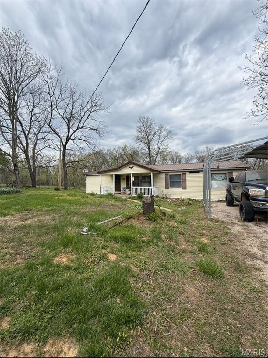 Great Investment property on 28 acres m/l. Very private location with outbuilding and pond.