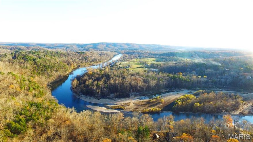 #1 Richbark Lane, Van Buren, MO- adorable cabin offering a perfect retreat on Current River. Hidden on a private lane, this property ensures peace and seclusion while being steps from the water’s edge.  Sale can include additional parcels surrounding cabin to protect your privacy. This has never flooded, offering a worry-free environment. Recently updated w/ new roof, HVAC, & fresh stain. Inside, you’ll find three bedrooms, twin bunks & hide-a-bed. The cabin is being sold furnished for a turn-key experience. An outdoor shower adds convenience for river lovers.  Large carport accommodates three boats and multiple vehicles. Private boat launch just down the road. The exterior features beautiful natural stonework, and the surrounding landscape has been curated to keep maintenance low while enhancing the natural beauty. The cabin’s location and thoughtful design combine to create a serene, intimate atmosphere—an ideal getaway for those seeking privacy, comfort, and connection to nature.