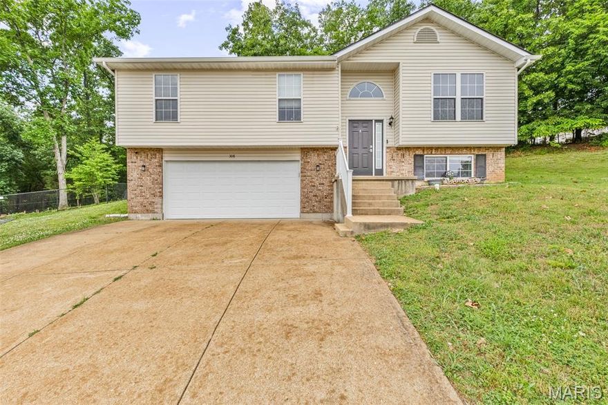 Fantastic split foyer home located on a quiet cul-de-sac is a must see!  Within walking distance to Larry Crites Park. The main floor offers an open floor plan with plenty of natural light, vaulted ceiling and beautiful new flooring throughout. The updated kitchen boasts plenty of cabinet and counter space as well as a pass-thru and breakfast area. Large living room with floor to ceiling wood covered faux fireplace as a focal point. Spacious master primary suite with ample closet space and full bath. Two additional bedrooms and an updated full bath complete the main floor. The lower level has a family/media room, fourth bedroom and updated full bath and laundry area. Sliding glass doors in the kitchen leads to the patio in the wooded yard which will be the highlight of outdoor entertaining. A two-car attached garage with storage completes this lovely home. Close to parks, disc golf course, restaurants and more.
