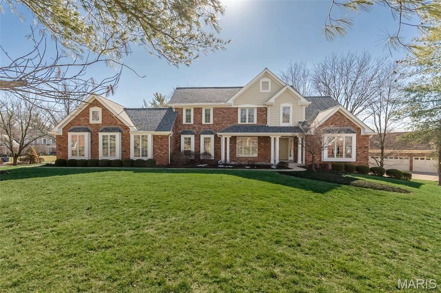 1st time available. Classic-styled brick 1.5 Sty in premier neighborhood. Maple hardwoods, soaring ceilings & detailed trim work add to the appeal of this exceptional Taylor Morley Simon-built home. Wide covered porch entrance leads to impressive 2-sty foyer, elegant dining room with tray ceiling & vaulted great room with wet bar, skylights & floor-to-ceiling stone fireplace flanked by full-height windows. Chef’s kitchen with 42” maple cabinetry, Corian countertops, premium appliances & 8’ center island adjoins light-filled breakfast room with bay window. Primary bedroom suite with beamed cathedral ceiling, 2 walk-in closets & beautifully appointed bath with heated floor & jetted tub offers an appealing retreat. Oak staircase accesses 3 generous-sized additional bedrooms & hall full bath. Expansive Lower Level includes recreation room & game room plus office/bedroom, workout room, bonus room & full bath. Located on a .55-acre cul-de-sac lot with extensive landscaping & finished 3-car garage.