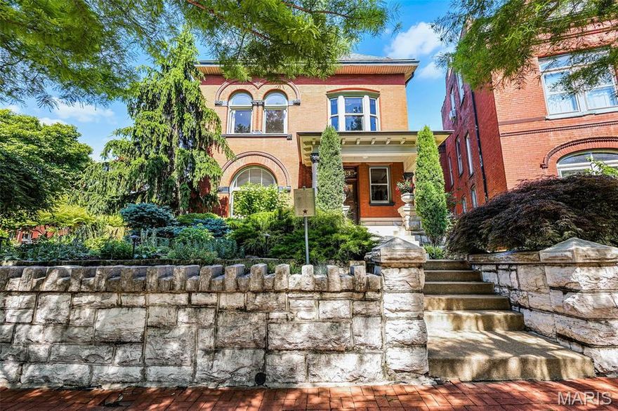 This rare Soulard home offers 2 distinct buildings on one lot: a beautifully preserved historic residence and a fully renovated contemporary carriage house. The primary home is light and bright with soaring ceilings, wood floors, 6 mantels, and room to entertain a crowd. Greeting you is a large foyer with a fireplace mantel, magnificent moldings, and a stunning staircase, framed by a large stained-glass window. The living room with a large half-circle window flows into a large dining room with a bayed window wall. A huge eat-in kitchen with a drop zone is perfect to demonstrate chef skills. Off the kitchen is a covered side porch overlooking private mature gardens, a paved patio, a fountain, and sun-dappled shaded areas perfect for BBQs, events, or entertaining family and friends. Literally a private oasis! Upstairs is the primary bedroom with a glass-enclosed sunporch and primary bath with walk-thru dressing room. 2 large bedrooms and a hall full bath complete the floor. The 3rd floor consists of two more bedrooms, a full bath, and an attic storage room. In the rear of the property is the large finished contemporary loft carriage house, perfect for extended family, a rental, or business. This location could not be better, 1 block to Soulard Farmers Market, BBQ, coffee shops, bars, live music, and walkable to Busch Stadium and the Arch. Celebrate Mardi Gras as you are 1 block from the parade route! Historic Soulard is a friendly neighborhood with a strong sense of community.
