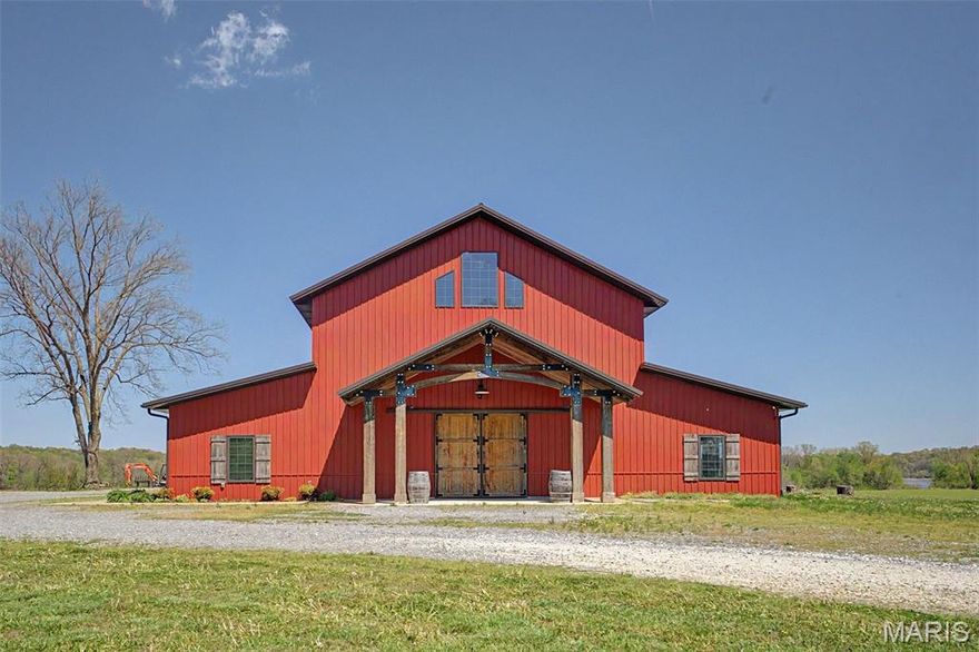 Introducing a great business opportunity with real estate in Scott City, MO!  Discover the natural beauty of Southeast Missouri at Amor on the River, a premier wedding and event venue nestled on the banks of the mighty Mississippi River.  Perched on a hill with breathtaking panoramic views of the river, passing barges, and historic trains crossing the Thebes Bridge, this property offers an unforgettable setting.  Featuring 6,700 square feet of versatile event space in an elegant barn-style building, full commercial kitchen with walk-in cooler, and a 1,470 square foot 2 bedroom, 2.5 bath apartment on the second floor which serves newlyweds and Airbnb customers like, this property has multiple revenue streams.  The building sits on 1.64 acres of gorgeous riverfront land with Mississippi River views, ideal for weddings, receptions, corporate events, private parties, and more.  Guests enjoy the peaceful sounds of the river, stunning sunsets, and the unique charm of watching river traffic and trains go by. The property’s elevated position provides sweeping, unobstructed views that make every event feel magical.  This turnkey venue is fully equipped and ready for continued success as a profitable business.  It has an established reputation as one of Southeast Missouri’s most sought-after wedding destinations, with strong potential for growth through expanded events and regular overnight accommodations.  Whether you're an investor, event professional, or someone dreaming of owning a slice of riverfront paradise, Amor on the River represents a rare opportunity to own a piece of Missouri history with modern event appeal!