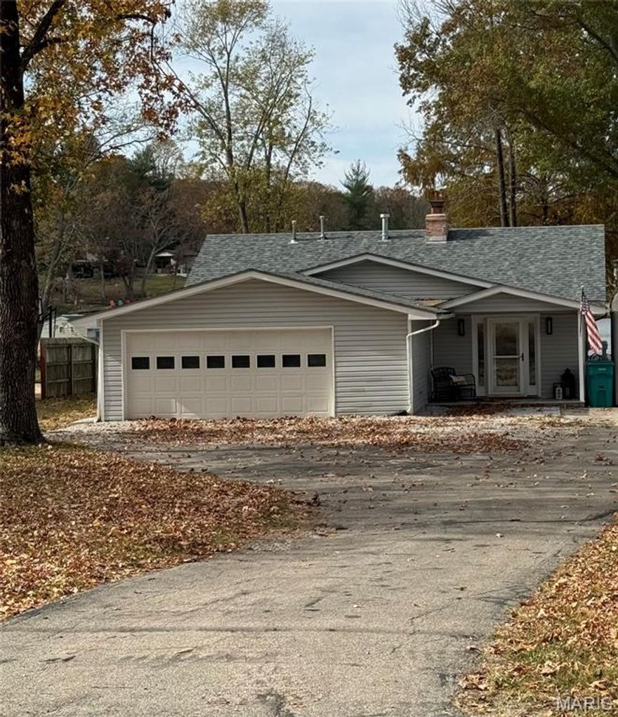 This beautifully remodeled 3 bedroom, 2 bathroom home sits on a flat, waterfront lot with direct lake access, a private boat dock with boat lift. The property includes an asphalt driveway, two-car garage or recreational room, and storage shed. With a brand-new roof, updated electrical and plumbing systems, modern HVAC, and a gas water heater. Updated kitchen with custom granite countertops, rich oak cabinetry, sleek appliances, and thoughtfully chosen hardware and fixtures. Unique engineered wood floors, quality interior doors, cordless top-down/bottom-up cellular shades, and thermal curtains. Whirlpool washer and dryer provide to add convenience. The outdoor spaces is perfect for entertaining features a large back porch with a bar, two concrete patios with pergolas, and breathtaking lake views right from your backyard. Enjoy the 326-acre lake nestled in a welcoming lake community with top-notch amenities.