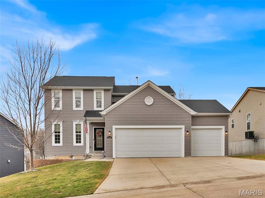 This young, Payne-built home, loaded with wonderful surprises, shows like new! The “care and keeping” is sure to impress as you enter this wonderful 2-story home with 3-car, fully finished garage. Step inside to a spacious foyer that draws you into a bright, open family room with loads of windows dressed with custom shades. The space flows nicely to the eat-in kitchen with granite countertops, stainless steel appliances, two pantries, upgraded lighting,  and center island with breakfast bar! Note the “drop zone” just in from the garage, sure to help with organization. Continue upstairs via a wider than normal set of stairs, adorned with a tasteful, decorative carpet and ‘board and batten’ wall system, to find the generously sized landing at the upper level. The roomy primary suite sports LVP flooring, a lighted ceiling fan, and a walk-in closet with custom closet system. The updated primary bathroom has two adult height sinks, upgraded lighting, and a beautifully tiled shower.  The 2nd and 3rd bedrooms, also with LVP, have custom closet systems too. And the bonus---The laundry room is on the upper level, the logical place to capture the dirty clothes!  Life just got simpler! The walk-out lower level is a blank slate, with three large windows, and a door to the backyard. The HVAC has a zoned damper system to create more consistent heating and cooling throughout the home. Last but not least, there is a composite deck just off the kitchen, a lower level patio, and an irrigation system. This gem is located just a short drive from Gravois Bluffs and nearly everything you’d need for shopping and restaurants!