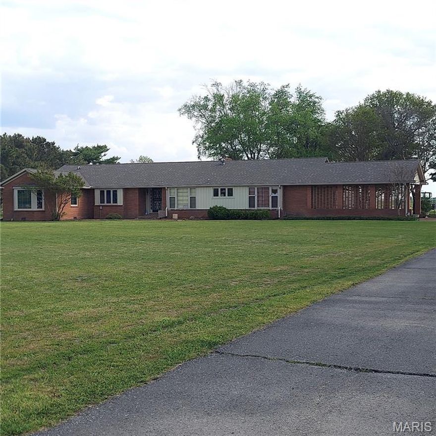 Welcome to 1760 County Highway 344 - LISTED BELOW APPRAISAL! This amazing brick home offers updates and mid century charm! Come enjoy the eat-in kitchen that has room for everyone to gather.  It boasts a center island, newer appliances, abundance of cabinets and built-ins plus a huge window to admire the beauty of the large front yard. Just off the kitchen is the main floor laundry closet for your convenience! The spacious dining room, living room and family room all offer beautiful refinished wood flooring and large windows with wood shutters. The 4 bedrooms are of great size with big closets, beautiful floors and some built-ins. The Primary bathroom has tile, a large sink vanity with plenty of drawers and cabinet, a large closet and luxury shower. Attached to the family room is a stunning 32 x 10 Sun Room, with brick floors, an abundance of windows, bay window and glass sliding doors to enjoy the views. The enormous backyard could be mistaken for a park with the amazing landscaping, winding brick pathways and court yard.   This property also has 3 other large buildings which are a Finished Shed is 11 x 24 with electric and plumbing,  Metal Shed 12 x 24, the Metal Shipping Container is 10 x 40 and the old Barn is 24 x 32 with 2 floors was used for horses.  The additional carport is 20 x 42! This home will let you live rural while being just minutes from town and highway 55!