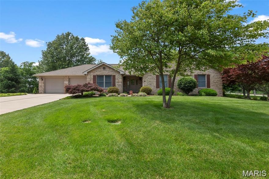 This beautifully maintained all-brick ranch offers the perfect blend of quality construction, space, and convenience. Situated on a desirable .63 acre corner lot in the heart of Jackson, you’ll enjoy quick access to local amenities, shopping, dining, and easy commutes to Cape Girardeau hospitals and more. With over 3,500 finished square feet, this home is designed for comfortable living and exceptional storage. The main-level two-car garage features a tandem space with a built-in work table, while the fully finished lower level boasts an additional two-bay garage—ideal for the hobbyist or workshop enthusiast.  Step inside to a welcoming entry that opens to a stunning living room with soaring vaulted ceilings, exposed beams, and a cozy fireplace. From here, access the concrete deck with composite stairs leading to the lower level—perfect for entertaining or relaxing outdoors.  The main floor includes three generously sized bedrooms and two full bathrooms, along with a separate formal dining room accented by elegant chair rail detailing. The kitchen is a true highlight, featuring abundant custom cabinetry by Beussink Cabinets, granite countertops, tile backsplash, breakfast bar, desk area and all-new stainless steel appliances. A charming breakfast nook offers the perfect spot to enjoy your morning coffee while overlooking the outdoors.  Completing the main level is a convenient half bath, a spacious laundry room with cabinetry and utility sink, and the tandem two-car garage.  The lower level expands your living space with a large family room with a fireplace, a full bedroom with a walk-in closet, a third full bathroom, and a dedicated game/media room. You’ll also find an impressive storage area with shelving and the oversized two-bay garage with dual overhead doors—perfect for projects and extra vehicles.  Outdoors,  the home features lush landscaping on a well-maintained lawn, sprinkler system, brick-inlaid outlined sidewalks, and driveway as well as a concrete deck and covered patio perfect for end-of-day relaxation. Located not far from Bent Creek Golf Course, this property combines peaceful surroundings with prime convenience.  Numerous improvements have been made during the current owners’ short time here, making this move-in-ready home an exceptional opportunity.  Call today to schedule your private showing!