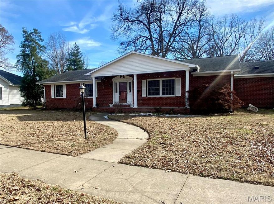 Priced at recent appraisal value! Located in the heart of town, you will enjoy the charm of small town living with the convenience of being steps away from the annual Dogwood Azalea Festival. This inviting 3-bedroom, 2-bath home offers a thoughtful layout perfect for both everyday living and entertaining. A formal living room greets you at the front of the home, providing an elegant space for hosting guests.  The spacious den features a cozy fireplace, built in shelving and ceiling beams, creating a warm and welcoming atmosphere. Open to the kitchen, this area serves as the true heart of the home—ideal for gathering with family and friends. The kitchen offers abundant cabinet and counter space, stainless steel appliances, and a breakfast bar for two stools. Wood floors run throughout most of the home, adding warmth and continuity to the living spaces. The primary suite provides a private escape with a double vanity and a walk-in shower designed for comfort. An attached garage provides added convenience and storage, and steps into a mudroom and laundry area (washer & dryer included) just off the kitchen. Step outside to enjoy the large backyard, surrounded by a white vinyl privacy fence, offering the perfect space for pets, play, gardening, or outdoor entertaining. With its prime location, charming details, and functional layout, this home is a great opportunity in one of Charleston’s most desirable areas.